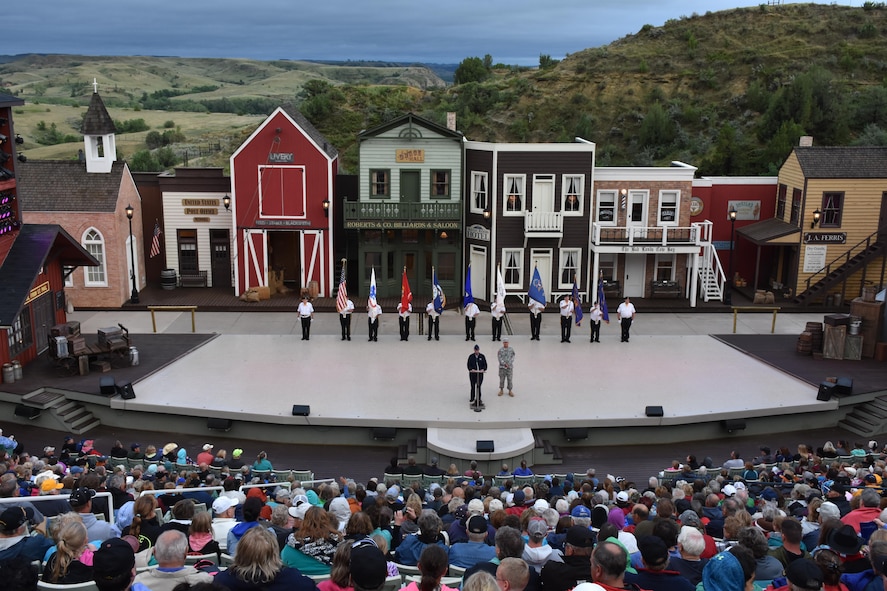 Col. Colin Connor, 91st Missile Wing commander, speaks during a veteran event at the Medora Musical in Medora, N.D., July 10, 2016. The event, hosted by the Theodore Roosevelt Medora Foundation, featured a welcoming social, flag ceremony, aircraft flyovers and free admittance to the musical. During his speech, the commander thanked the near 500 veterans in attendance and spoke about how the 91st MW Airmen uphold the Teddy Roosevelt Roughriders’ namesake in their daily mission. (Courtesy photos)