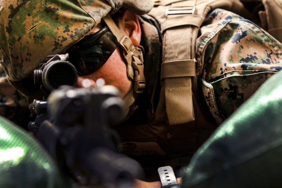 Marine Corps Pfc. Simon Gomez Ramirez provides security after constructing a defensive position during Exercise Eagle Wrath 2016 at Combined Arms Training Center Camp Fuji, Japan, July 14, 2016. Gomezramirez is a combat engineer assigned to Marine Wing Support Squadron 171. Marine Corps photo by Lance Cpl. Aaron Henson