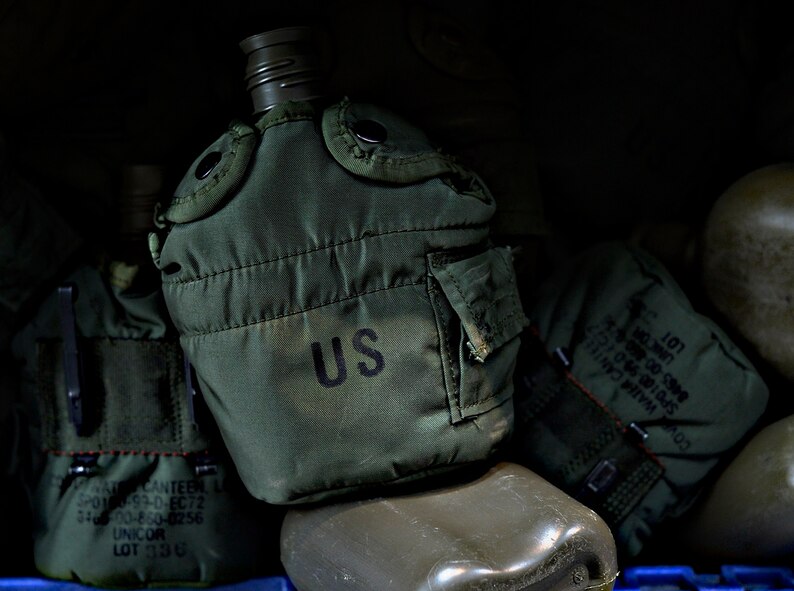 Canteens lay inside a storage bin at Ramstein Air Base, Germany, July 15, 2016. The 86th Logistics Readiness Squadron Individual Protective Equipment Element issues training and deployment items such as water canteens, ammo pouches, helmets and gas masks. The IPE element organizes, keeps inventory, tests and inspects all deployment and training gear. (U.S. Air Force photo/ Senior Airman Nesha Humes)