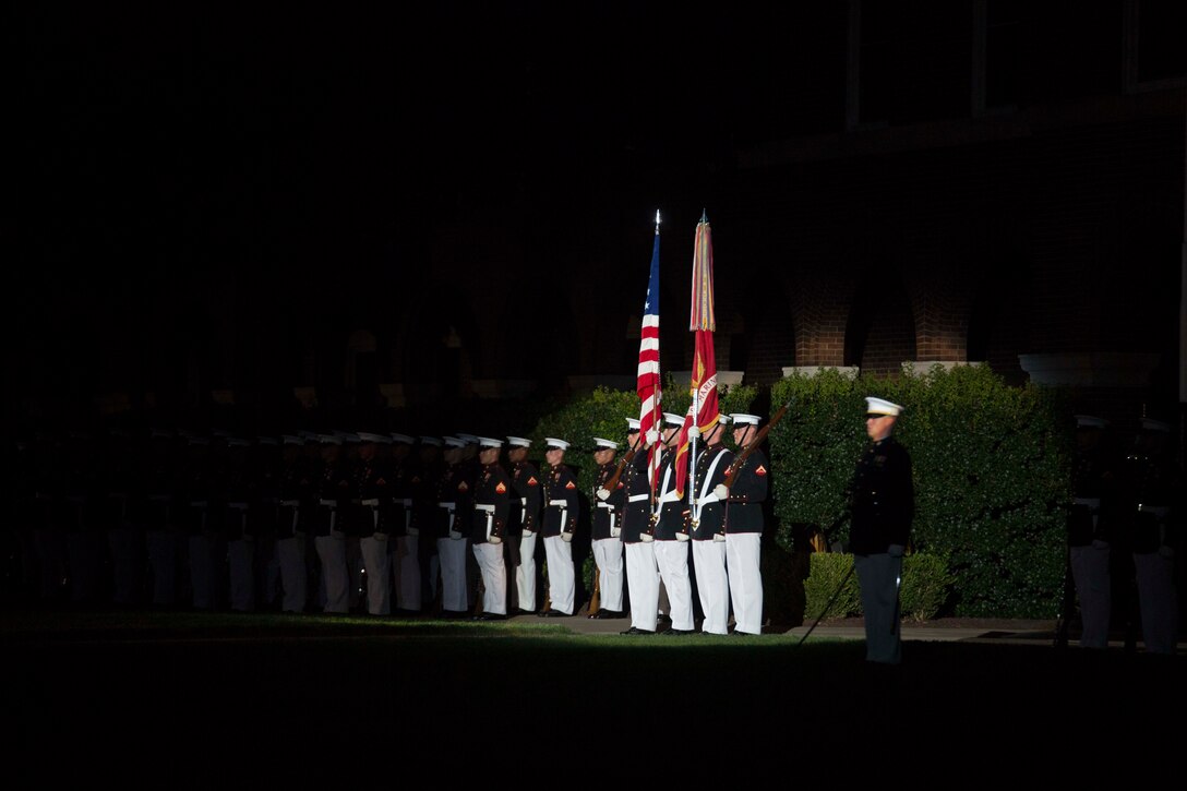 The United States Marine Corps Color Guard performs during the Evening Parade at Marine Barracks Washington, D.C., July 15, 2016. The guest of honor for the parade was the Honorable John Cornyn, United States Senator for Texas, and the hosting official for the evening was Gen. Robert Neller, commandant of the Marine Corps. (Official Marine Corps photo by Cpl. Chi Nguyen/Released)