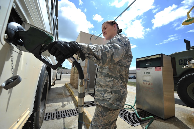 Senior Airman Lisa Exline, a vehicle operator with the 1st Special Operations Logistics Readiness Squadron, puts gas in a bus at Hurlburt Field, Fla., July 15, 2016. The 1st SOLRS will be supporting the Air Force Special Operations Command Change of Command July 19, 2016, by providing a shuttle service. Pickup locations include the Base Chapel, the Aderholt Gym, 4th Aircraft Maintenance Unit and the Base Exchange. (U.S. Air Force photo by Airman Dennis Spain) 