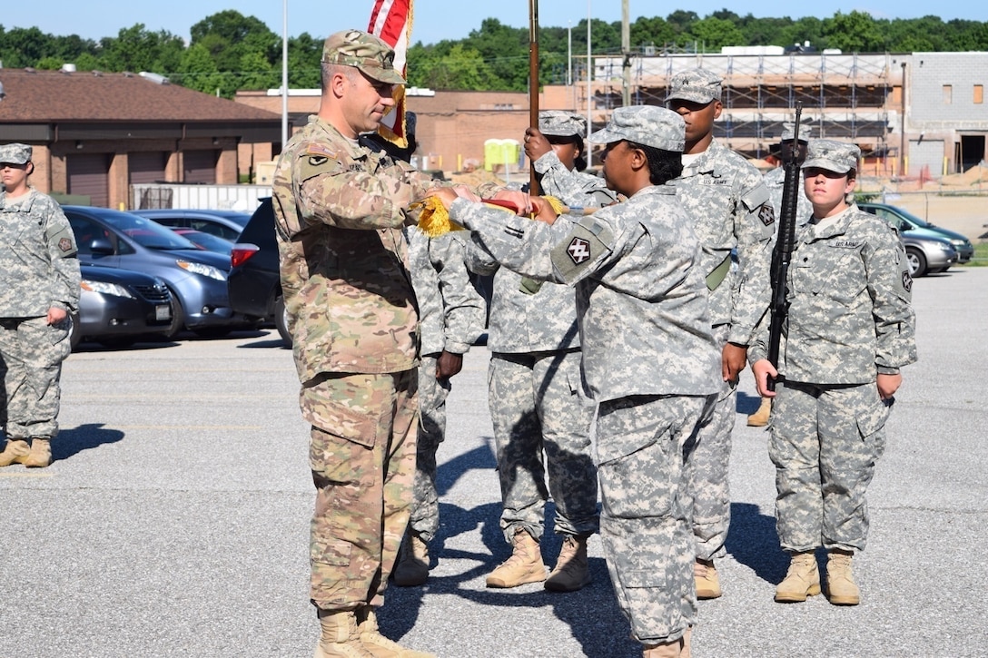 Lt. Col. Christopher J. Buzard commander of the 313th Movement Control Battalion, and Command Sgt. Maj. Selena C. Pope, the senior enlisted advisor for the unit case the colors during a deployment ceremony on July 10, 2016, in Baltimore, Md., at the 1SG Adam S. Brandt United States Army Reserve Center. The 313th MCB is scheduled to deploy to the Middle East in support of Operation Enduring Freedom