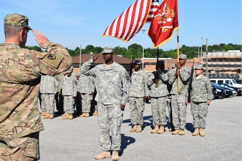 Lt. Col. Christopher J. Buzard, commander of the 313th Movement Control Battalion, prepares to case the unit colors during a deployment ceremony on July 10, 2016, in Baltimore, Md., at the 1SG Adam S. Brandt United States Army Reserve Center. The 313th MCB is scheduled to deploy to the Middle East in support of Operation Enduring Freedom.