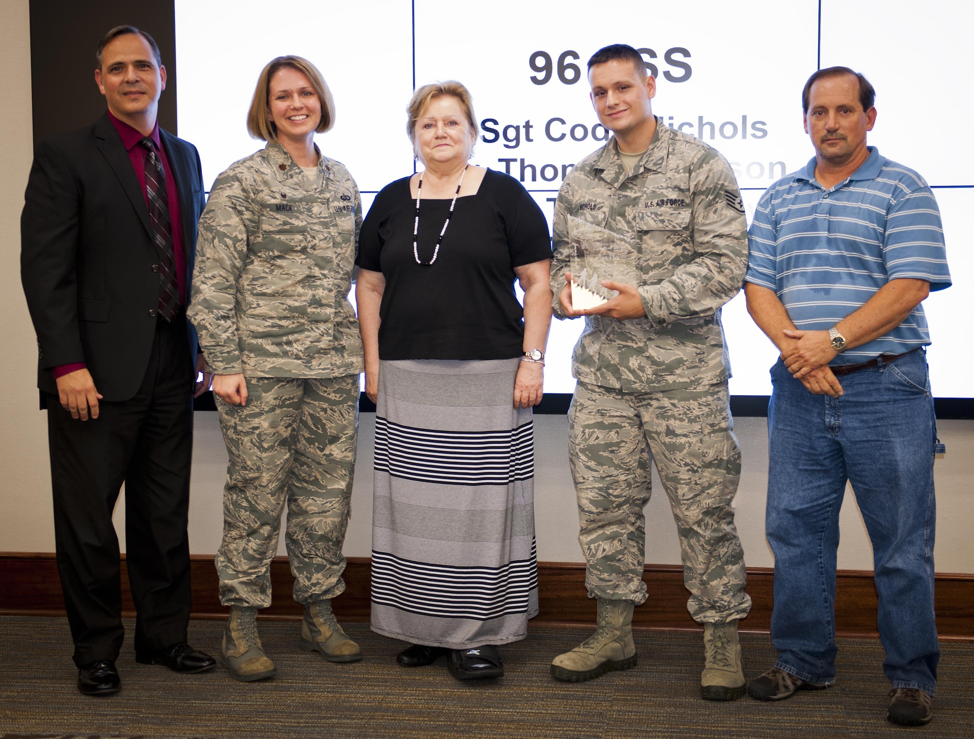 Chris Simpson, 96th Test Wing information protection director, Maj Jennifer Mack, 96th Force Support Squadron commander, Janet Lucas, and Staff Sgt. Cody Nichols and Thomas Johnson, 96th FSS security managers, took part in the first-ever Evonne Samuels Inspirational Award presentation at a ceremony here July 14. The award was created in honor of an industrial security specialist who lost her battle to cancer last year. The accolade recognizes the most improved and inspiriting information security program of the year. The two security managers and their teammates, Tech. Sgts. Tony Gandy and Andrea Sierra were recognized. Samuels’ mother, Lucas, presented the award. (U.S. Air Force Photo/Jasmine Porterfield)