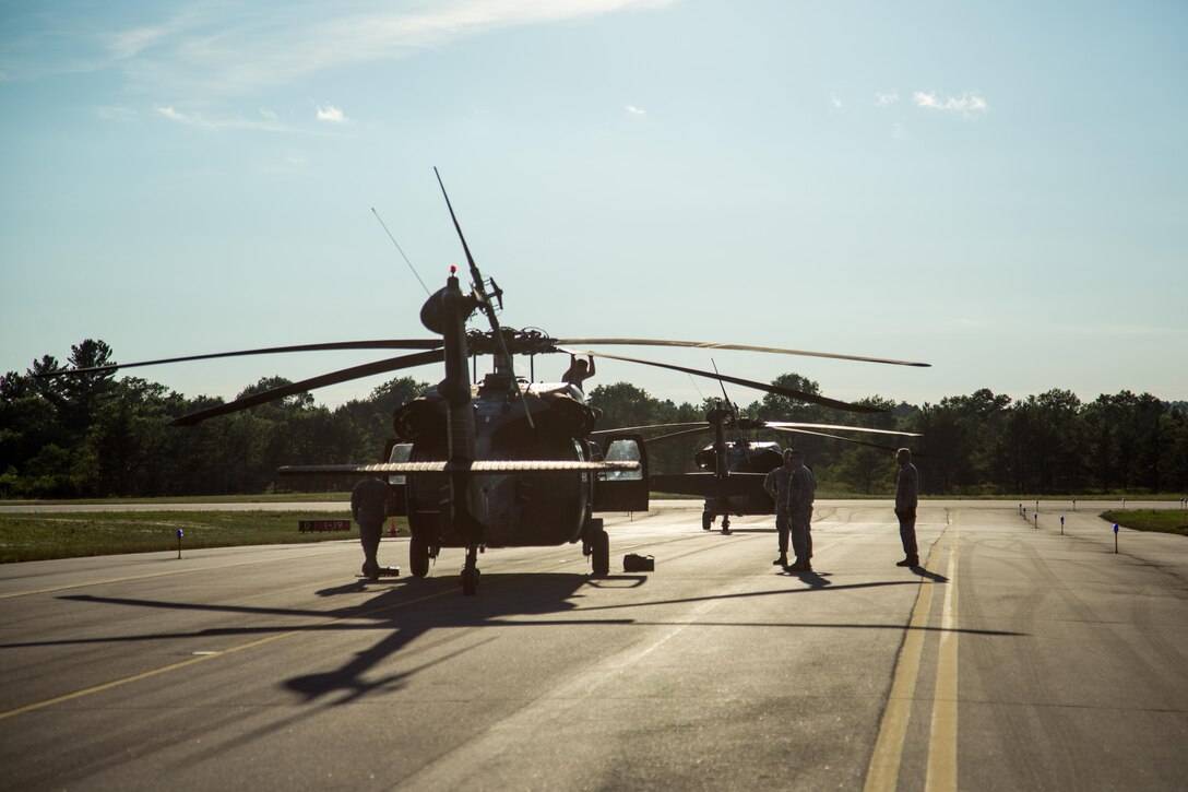 U.S. Army National Guard soldiers with the F Company, 2-238th General Support Aviation Battalion, West Bend, Wis., standby prior to a flight mission during Warrior Exercise (WAREX) 86-16-03 at Fort McCoy, Wis., July 14, 2016. WAREX is designed to keep soldiers all across the United States ready to deploy. (U.S. Army photo by Sgt. Robert Farrell/Released)