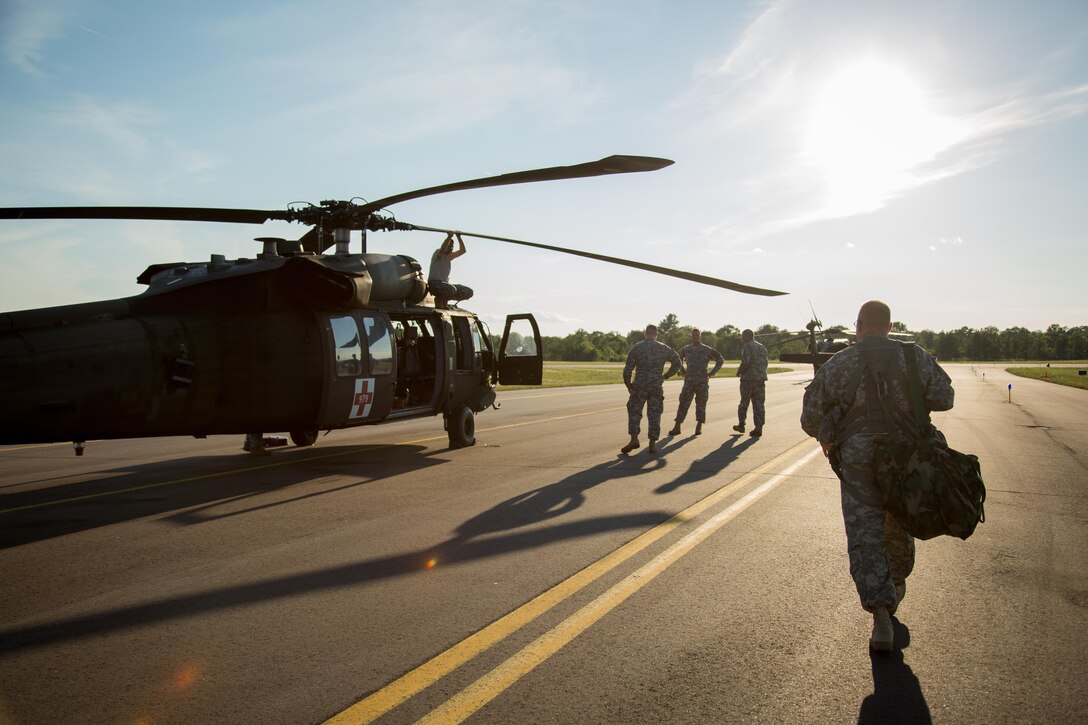 U.S. Army National Guard 1st Sgt. Patrick Deuberry, F Company, 2-238th General Support Aviation Battalion, West Bend, Wis., approaches a UH-60 Blackhawk helicopter prior to a flight mission during Warrior Exercise (WAREX) 86-16-03 at Fort McCoy, Wis., July 14, 2016. WAREX is designed to keep soldiers all across the United States ready to deploy. (U.S. Army photo by Sgt. Robert Farrell/Released)