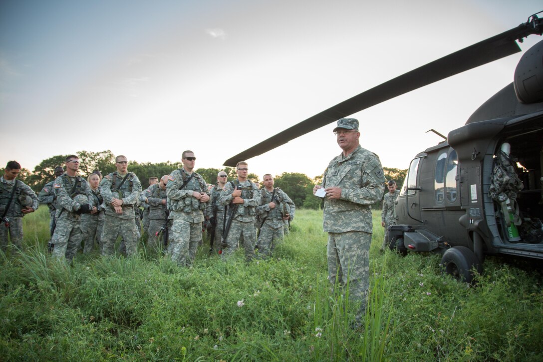 U.S. Army National Guard 1st Sgt. Patrick Deuberry, F Company, 2-238th General Support Aviation Battalion, West Bend, Wis., instructs soldiers under the 330th Medical Brigade on Medical Evacuation procedures during Warrior Exercise (WAREX) 86-16-03 at Fort McCoy, Wis., July 14, 2016. WAREX is designed to keep soldiers all across the United States ready to deploy. (U.S. Army photo by Sgt. Robert Farrell/Released)