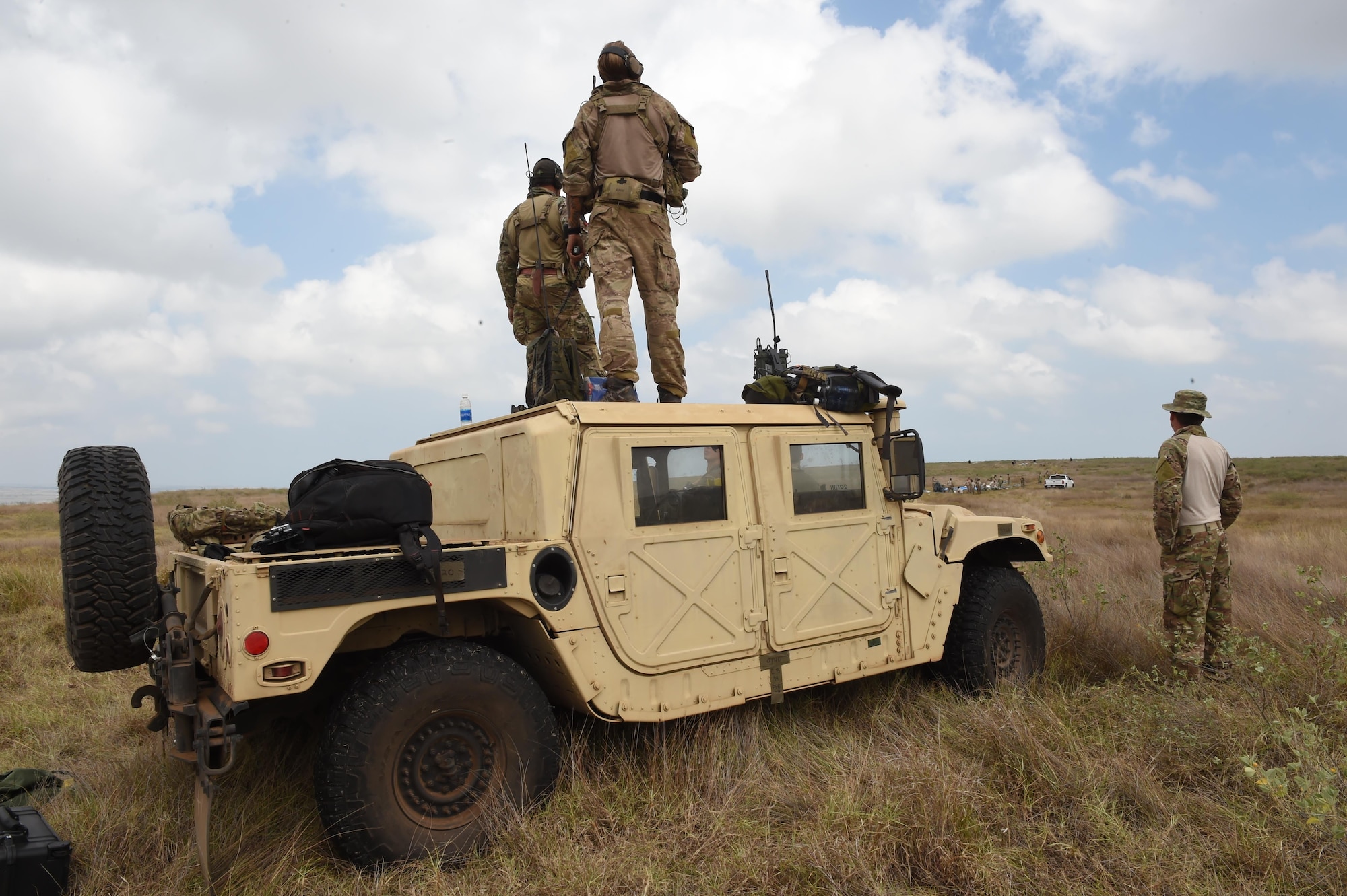 Combat controllers with the 320th Special Tactics Squadron control the air traffic during a multi-aircraft, joint airborne operation with special operations assets and conventional forces from all four branches of the U.S. Armed Forces as part of Rim of the Pacific (RIMPAC) 2016 to strengthen their relationships and interoperability with their partners, Pohakuloa Training Area, Hawaii, July 14, 2016. Twenty-six nations, more than 40 ships and submarines, more than 200 aircraft and 25,000 personnel are participating in RIMPAC from June 30 to Aug. 4, in and around the Hawaiian Islands and Southern California. (U.S. Air Force photo by 2nd Lt. Jaclyn Pienkowski/Released)