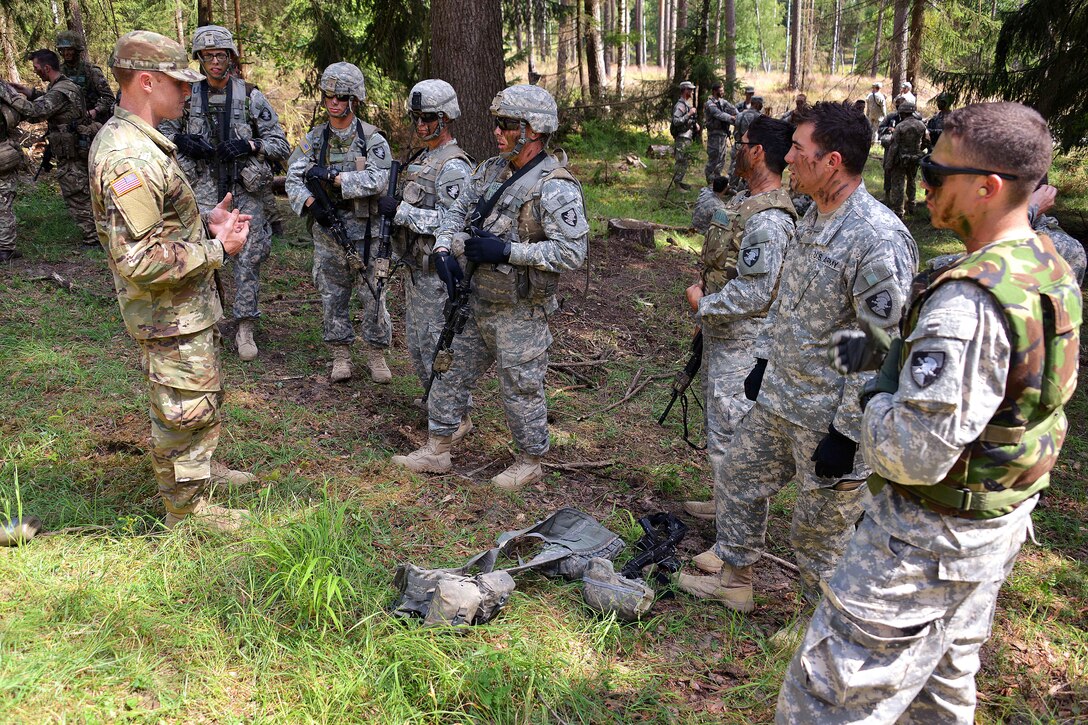Army cadets receive a mission brief before training alongside British cadets during Exercise Dynamic Victory at the Grafenwoehr Training Area, Germany, July 11, 2016. The exercise is the final field exercise for Sandhurst cadets before they become commissioned officers in the British army. The U.S. cadets are assigned to the U.S. Military Academy in West Point, N.Y. The British cadets are assigned to the British Army Royal Military Academy Sandhurst. Army photo by Gertrud Zach