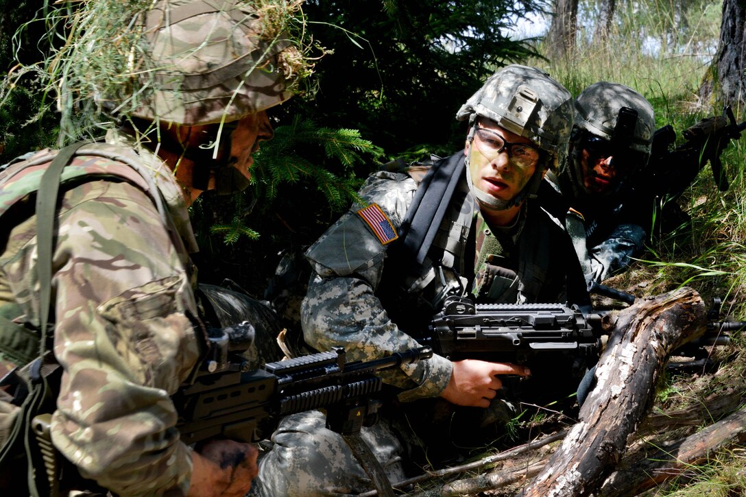 U.S. Army cadets, right, discus tactical movements with a British army cadet during Exercise Dynamic Victory at the Grafenwoehr Training Area, Germany, July 11, 2016. Army photo by Gertrud Zach