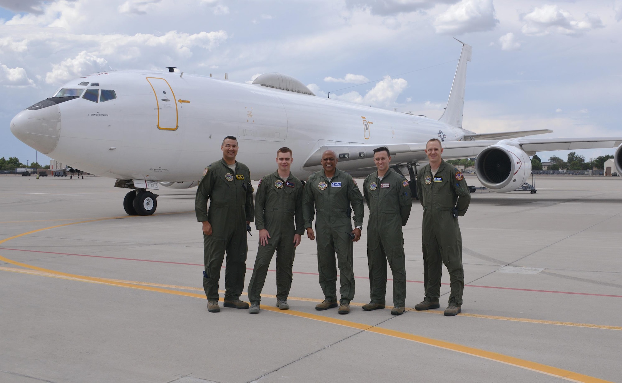 Maj. Gen. Anthony Cotton, 20th Air Force and Task Force 214 commander, center, takes a photo at Kirtland with, from left to right, Lt. Col. Christopher Picinni, Airborne National Command Post mission commander; Capt. Nate Larson, 90th Operations Support Squadron; Capt. Kerry Dubuisson, 91st Operations Support Squadron; and Capt. Greg Carter, ALCS/Intel Officer and Strike Planner June 26, 2016. Missileers from across the 20th Air Force accompanied the 20th Air Force commander on the Airborne National Command Post to witness the national impact of the ICBM mission. (Photo by Dennis Carlson)