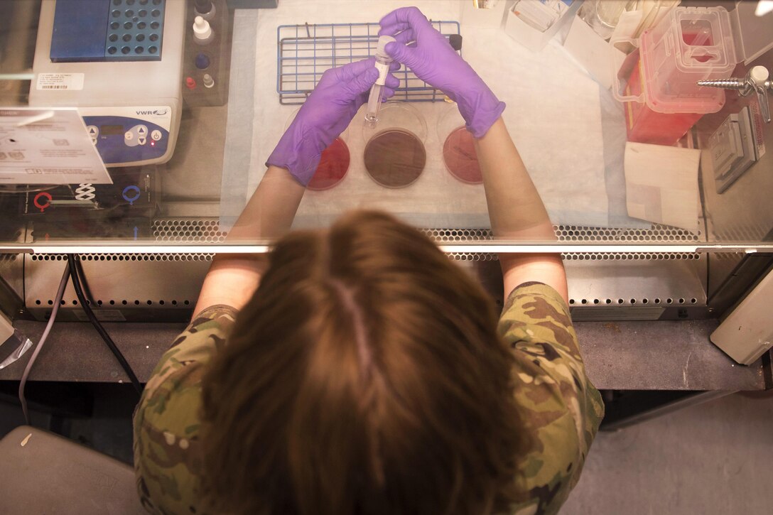 Air Force Staff Sgt. Megan Montagnino cultures a sample of cerebral spinal fluid in the Craig Joint Theater Hospital at Bagram Airfield, Afghanistan, July 8, 2016. Montagnino, the noncommissioned officer in charge, is assigned to the Expeditionary Medical Group microbiology and the blood bank. Air Force photo by Senior Airman Justyn M. Freeman