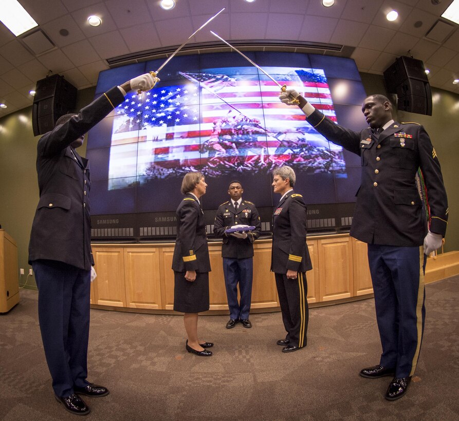 U.S. Army Reserve Maj. Gen. Janet Lynn Cobb (in skirt), commander of the 81st Regional Support Command, prepares to present the American flag to Brig. Gen. Janice M. Haigler, deputy commanding general of the 335th Signal Command (Theater) during Haigler’s retirement ceremony at Fort Jackson, S.C., July 16, 2016. (U.S. Army photo by Staff Sgt. Ken Scar)