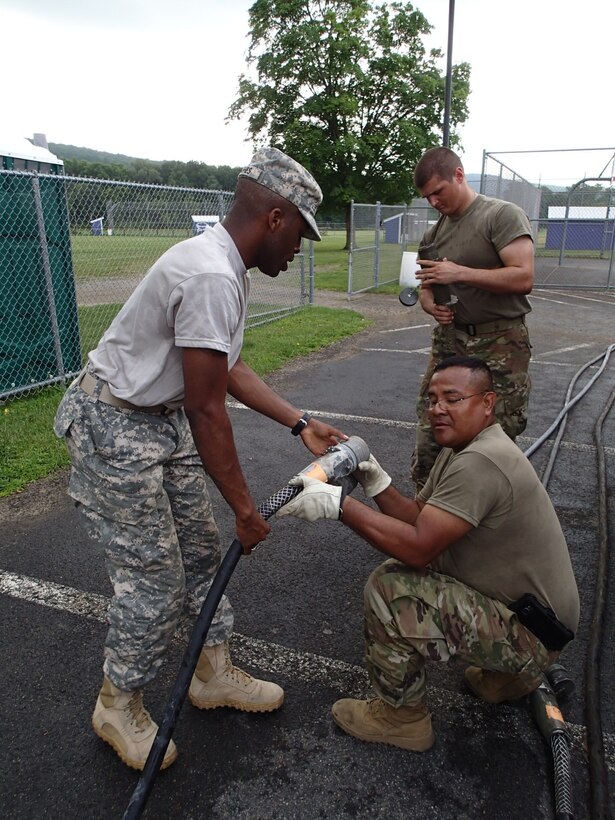 Soldiers from Company A, 48th Combat Support Hospital out of Fort Story, Va., set up electricity for the tents for veterinary services in preparation for Greater Chenango Cares July 14, 2016. Greater Chenango Cares is one of the Innovative Readiness Training missions which provides real-world training in a joint civil-military environment while delivering world-class medical care to the people of Chenango County, N.Y., from July 15-24.