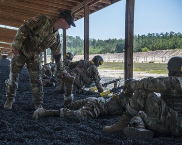 After firing shot groups on the zero range Soldiers in Basic Combat Training with Company B, 2nd Battallion, 60th Infantry Regiment at Fort Jackson, S.C., have their weapons cleared by their drill sergeants, July 14. (U.S. Army photo by Sgt. 1st Class Brian Hamilton/ released)