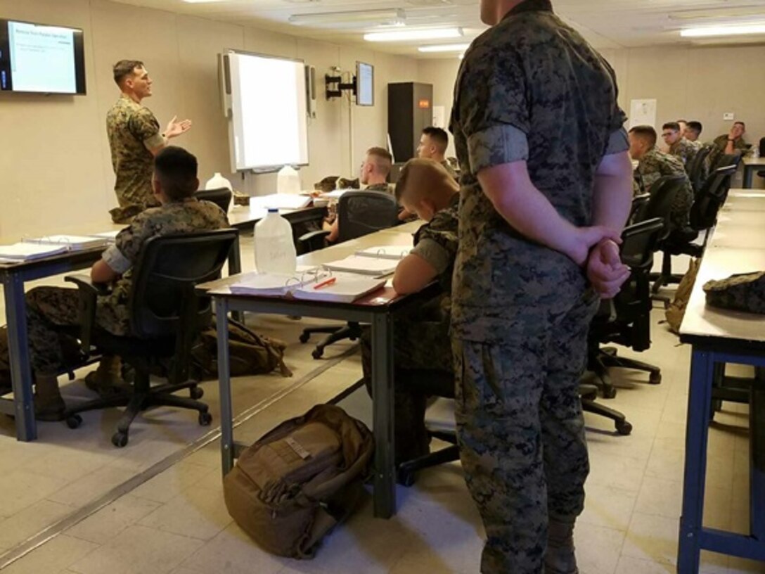 Sergeant Bobby D. Bruce, an instructor with Utilities Instruction Company, gives a period of instruction to Marines attached to Basic Engineer Equipment Electrical Systems Technician course 7-16 (BEEEST 7-16) on paralleling Mobile Electrical Power (MEP) 807 generators. The Marines will be tested on this information later in the course through practical applications, exams, and field exercises. 

