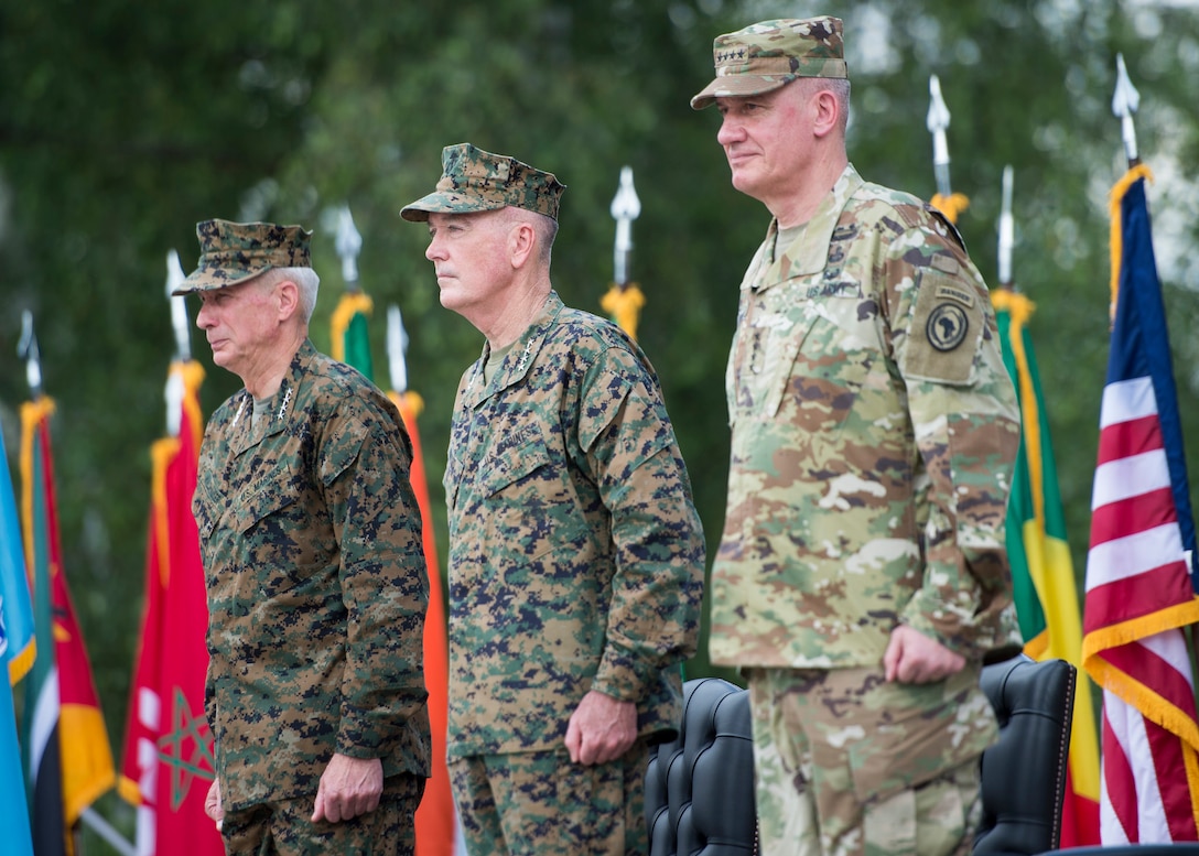Marine Corps Gen. Thomas D. Waldhauser, left, incoming commander of U.S. Africa Command, Marine Corps Gen. Joe Dunford, chairman of the Joint Chiefs of Staff, and Army Gen. David M. Rodriguez, outgoing commander, stand at attenton during the change-of-command ceremony at U.S. Army Garrison Stuttgart, Germany, July 18, 2016. DoD photo by Navy Petty Officer 2nd Class Dominique A. Pineiro