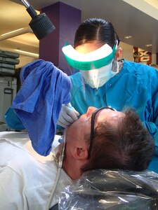 Sgt. Caroline Fuel, a dental hygienist from the 185th Dental Company, Orange County, Calif., provides dental care during Greater Chenango Cares on July 15, 2016.  Greater Chenango Cares is one of the Innovative Readiness Training events which provides real-world training in a joint civil-military environment while delivering world class medical care to the people of Chenango County, N.Y., from July 15-24.