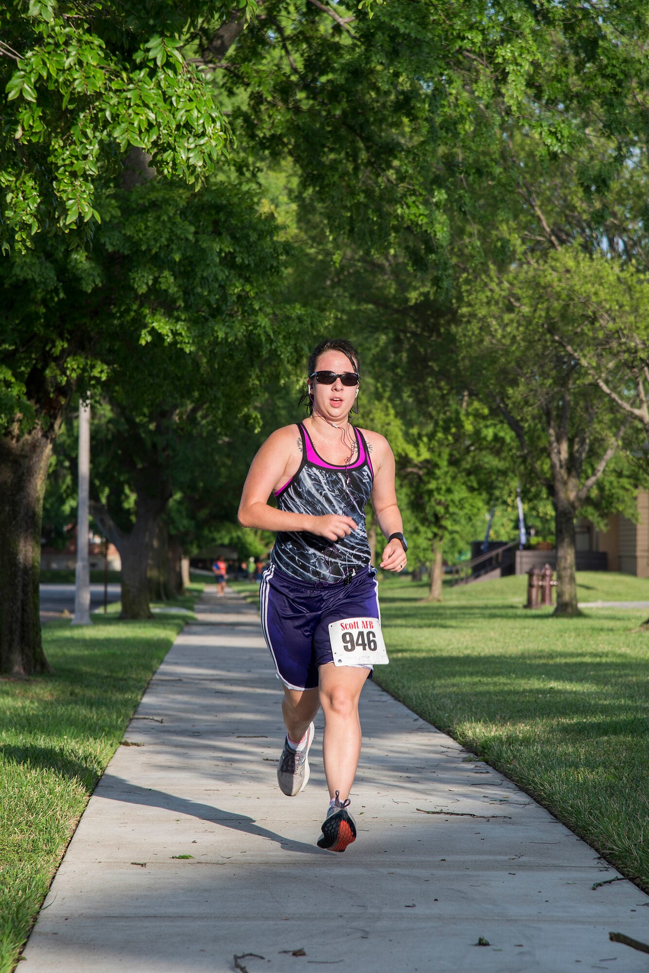 Senior Airman Ashleigh Leonard, 561st Network Operations Squadron Detachment 3, participates in the run portion of the “Splash N Dash” biathlon at Scott Air Force Base, Illinois, July 15, 2016. The biathlon required members to complete a 300 meter swim followed by a three mile run. Robert Wieland had the fastest time in the male category, 24 minutes 44 seconds, while Kimberly Wendt had the fastest time in the female category, 33 minutes 31 seconds. (U.S. Air Force photo by Tech. Sgt. Jonathan Fowler)