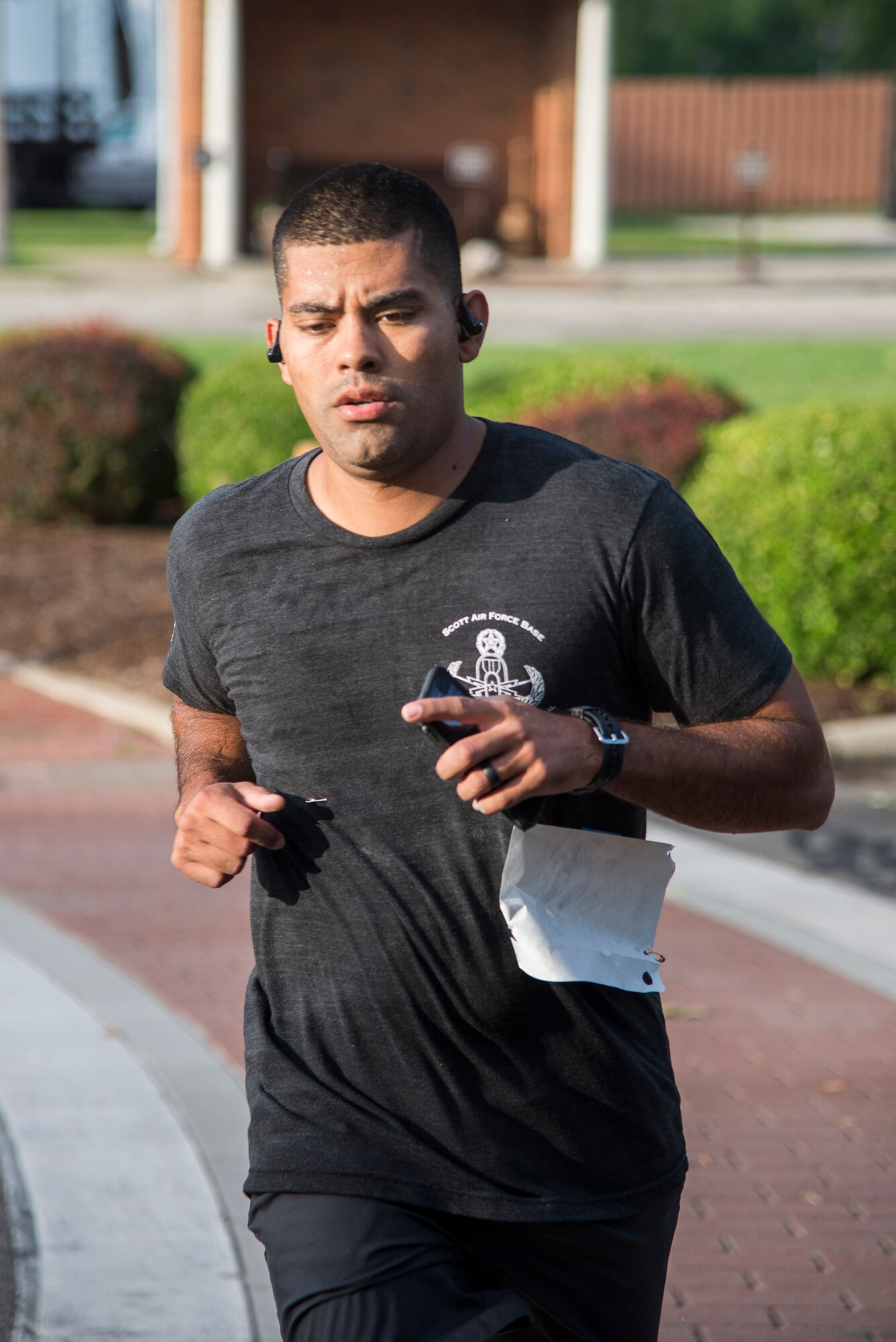 A Team Scott member participates in the run portion of the “Splash N Dash” biathlon at Scott Air Force Base, Illinois, July 15, 2016. The biathlon required members to complete a 300 meter swim followed by a three mile run. Robert Wieland had the fastest time in the male category, 24 minutes 44 seconds, while Kimberly Wendt had the fastest time in the female category, 33 minutes 31 seconds. (U.S. Air Force photo by Tech. Sgt. Jonathan Fowler)