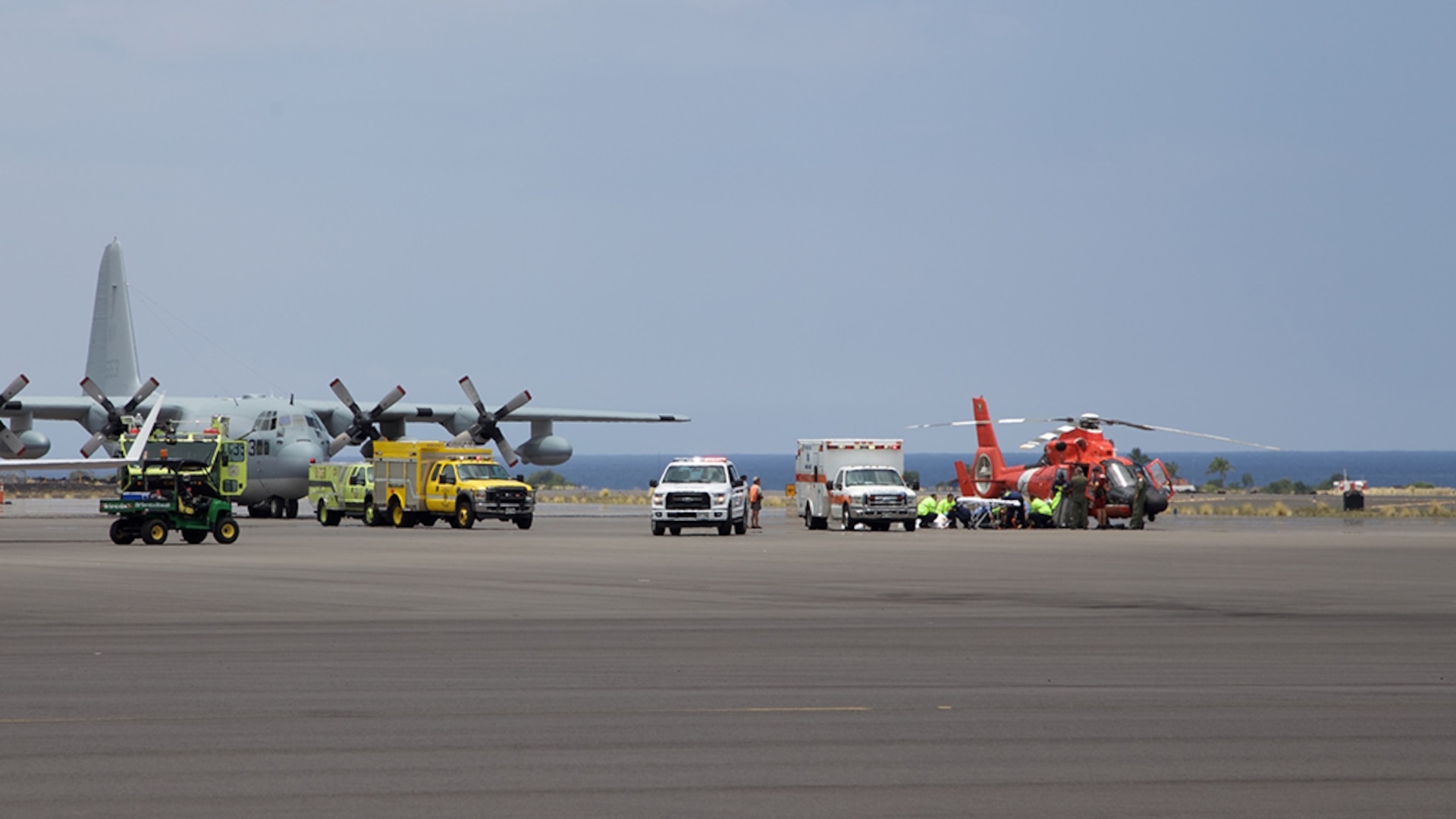 Coast Guard crews safely deliver David McMahon and Sidney Uemoto to emergency medical personnel in Kona, Hawaii, July 15, 2016, following their rescue nine miles off Kona. They were both rescued by a Coast Guard MH-65 Dolphin helicopter crew following an expansive joint search by Navy, Royal New Zealand air force, U.S. Air Force and Coast Guard crews. They reportedly sustained only minor injures in the crash.