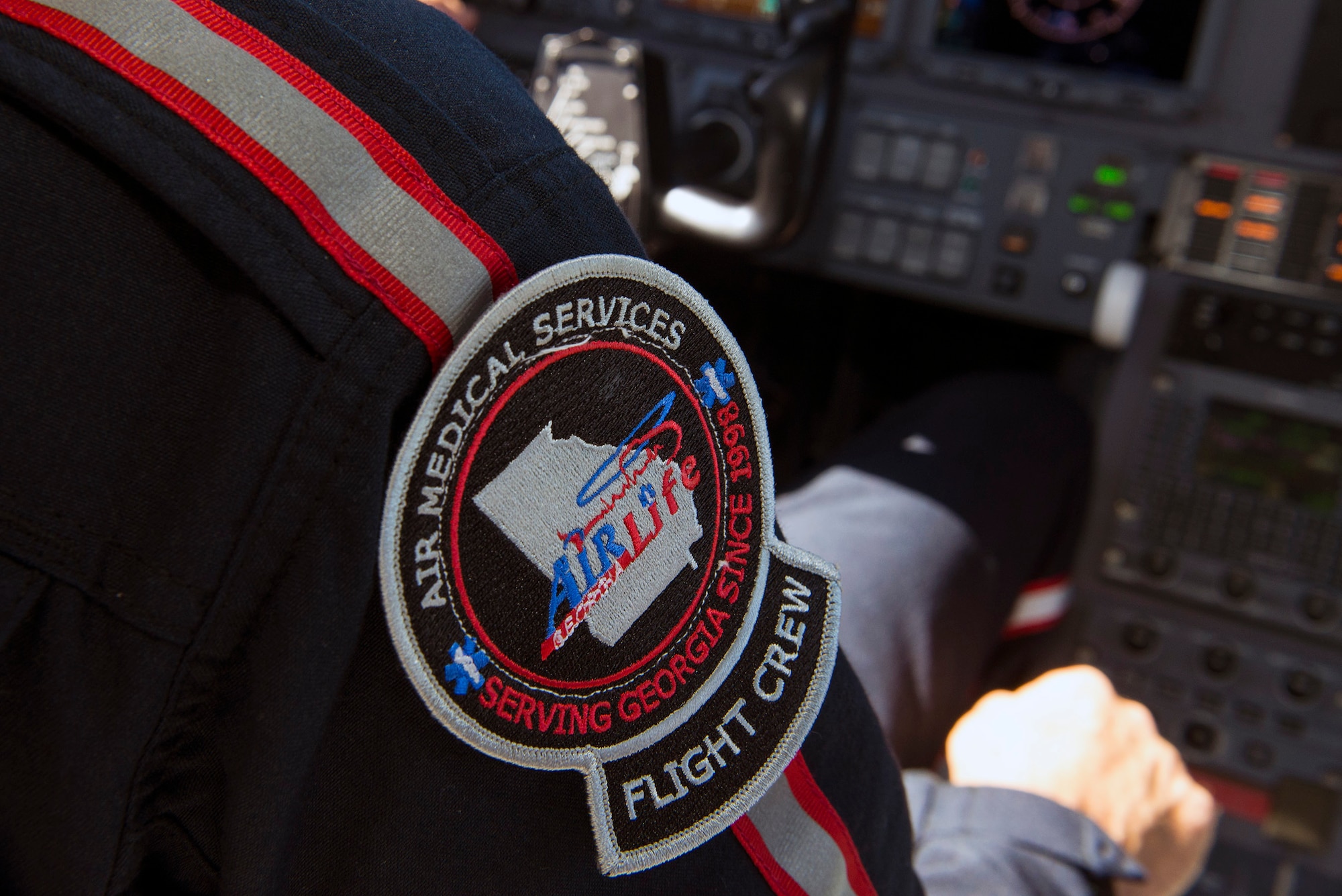 An Air Medical Services flight crew patch rests on U.S. Air Force Reserve Master Sgt. Rusty Harrell’s, 476th Fighter Group career assistance advisor, uniform as he performs a daily check during a pre-flight assessment, July 13, 2016, at Moody Air Force Base, Ga. Harrell received his AMS license in April 2016 which certified him to fly emergency transport medical missions. (U.S. Air Force photo by Airman 1st Class Greg Nash)