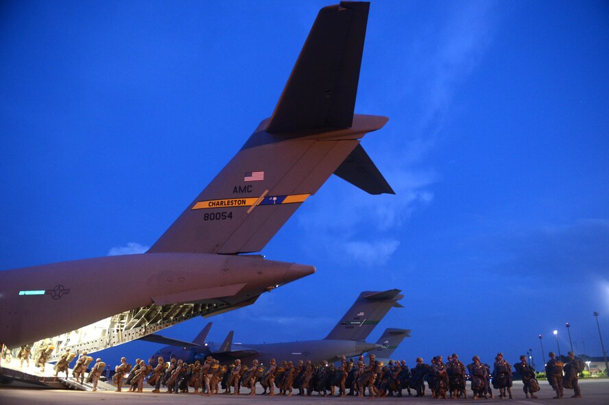 Soldiers from the 82nd Airborne Division load onto a C-17 Globemaster III from Joint Base Lewis-McChord, Wash., during battalion mass tactical week at Pope Army Airfield, N.C., July 12, 2016. During the exercise, Army and Air Force units worked together to improve interoperability for worldwide crisis, contingency and humanitarian operations. (U.S. Air Force photo/Staff Sgt. Sandra Welch)