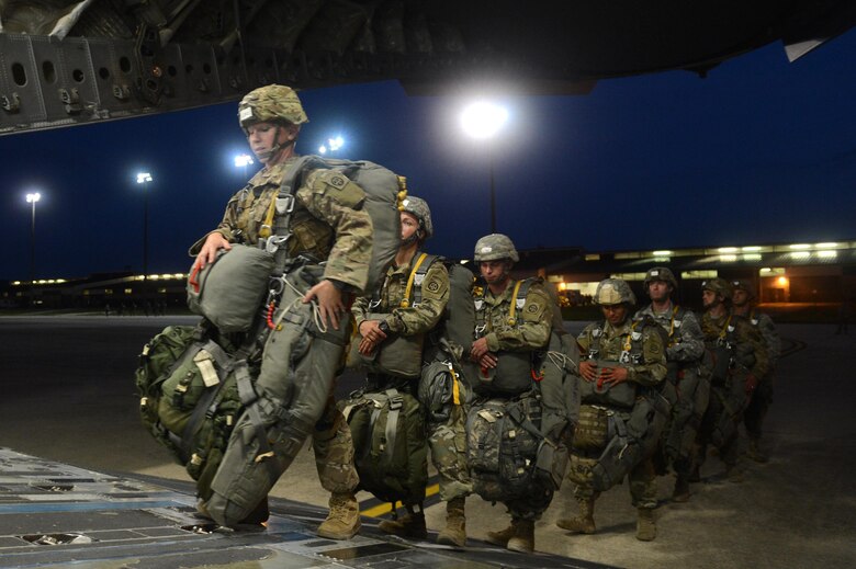 U.S. Army members from the 82nd Airborne Division load onto a C-17 Globemaster III aircraft from Joint Base Lewis-McChord, W.A., during Battalion Mass-Tactical week at Pope Army Airfield, N.C., July 12, 2016. During mass-tactical week the Army and Air Force units work together to improve interoperability for worldwide crisis, contingency and humanitarian operations. (U.S. Air Force photo by Staff Sgt. Sandra Welch)