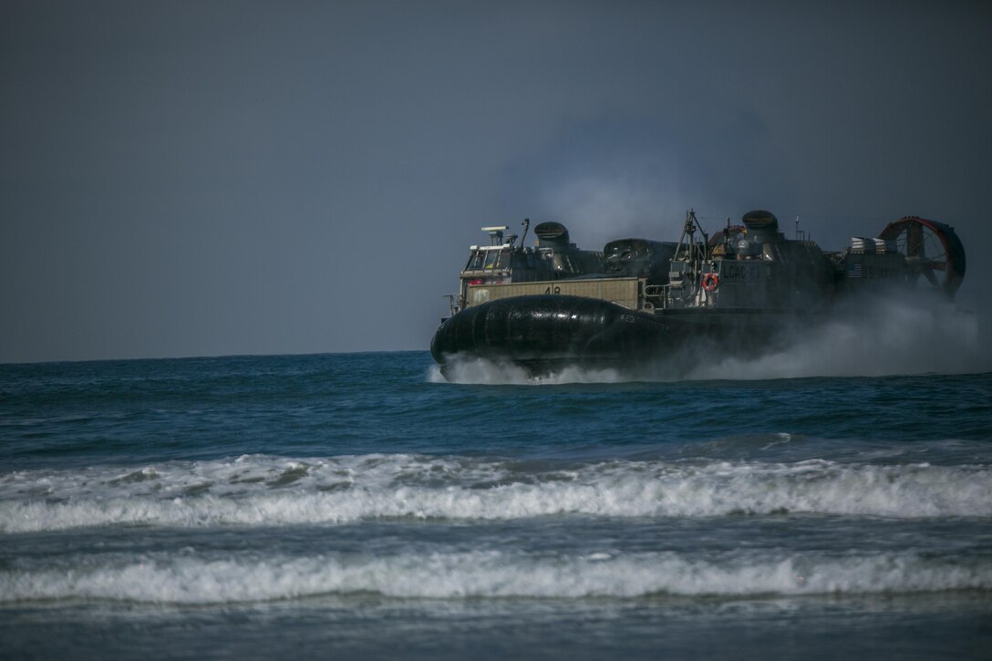Marines with 4th Tank Battalion, 4th Marine Division, Marine Forces Reserve, perform a beach landing on a landing craft air cushion during their annual training aboard Marine Corps Base Camp Pendleton, Calif., July 16, 2016. Annual training exercises ensure that Reserve Marines are trained and prepared for any future operation or contingency. (U.S. Marine Corps photo by Cpl. Gabrielle Quire/Released)