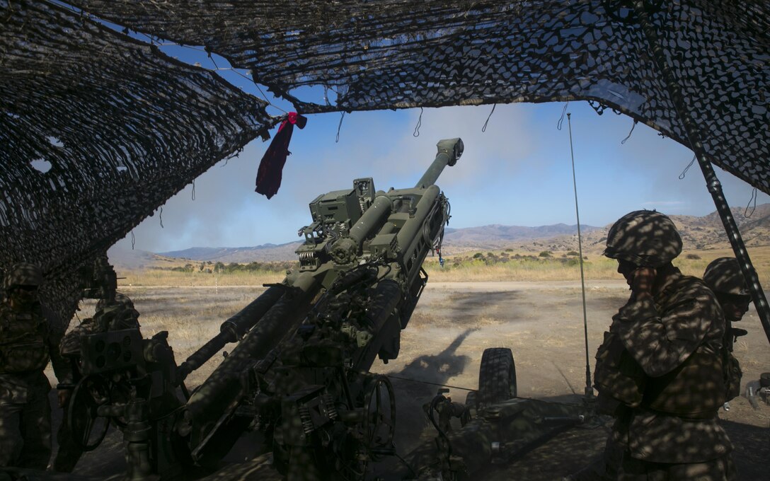 Marines with Battery Q, 5th Battalion, 14th Marine Regiment, 4th Marine Division, Marine Forces Reserve, fire a M777A2 Howitzer during their annual training exercise at Marine Corps Base Camp Pendleton, Calif., July 16, 2016. Annual training exercises ensure that Reserve Marines are trained and prepared for any future operation or contingency. (U.S. Marine Corps photo by Cpl. Gabrielle Quire/Released)
