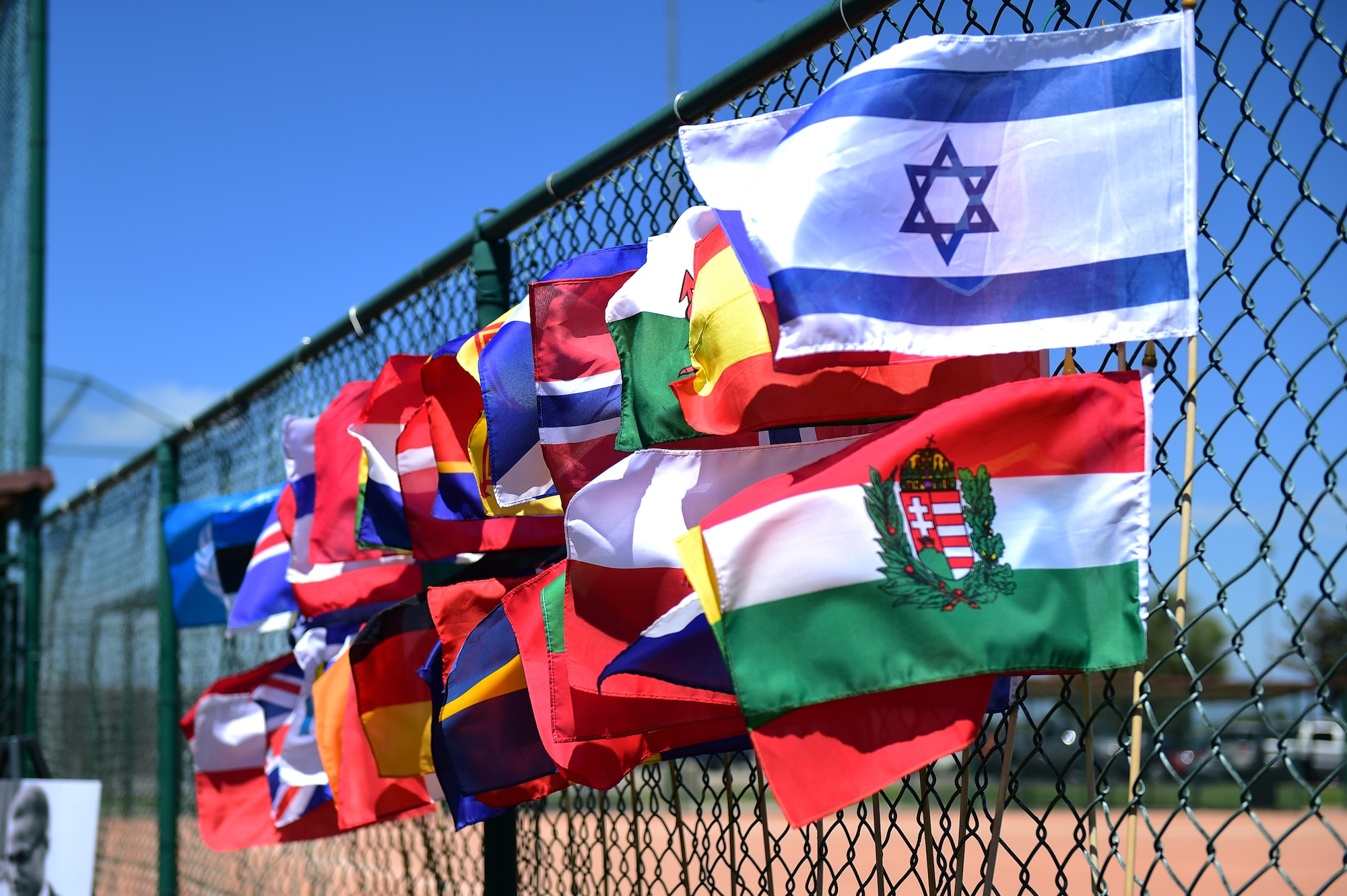 Flags wave in the wind July 15, 2016, to provide an idea of the different cultures from around the world during Diversity Day on Buckley Air Force Base, Colo. Diversity Day provided an opportunity to explore and celebrate the accomplishments and cultures of a diverse military force, which included food, dancing and music from various cultures. (U.S. Air Force photo by Airman 1st Class Gabrielle Spradling/Released)