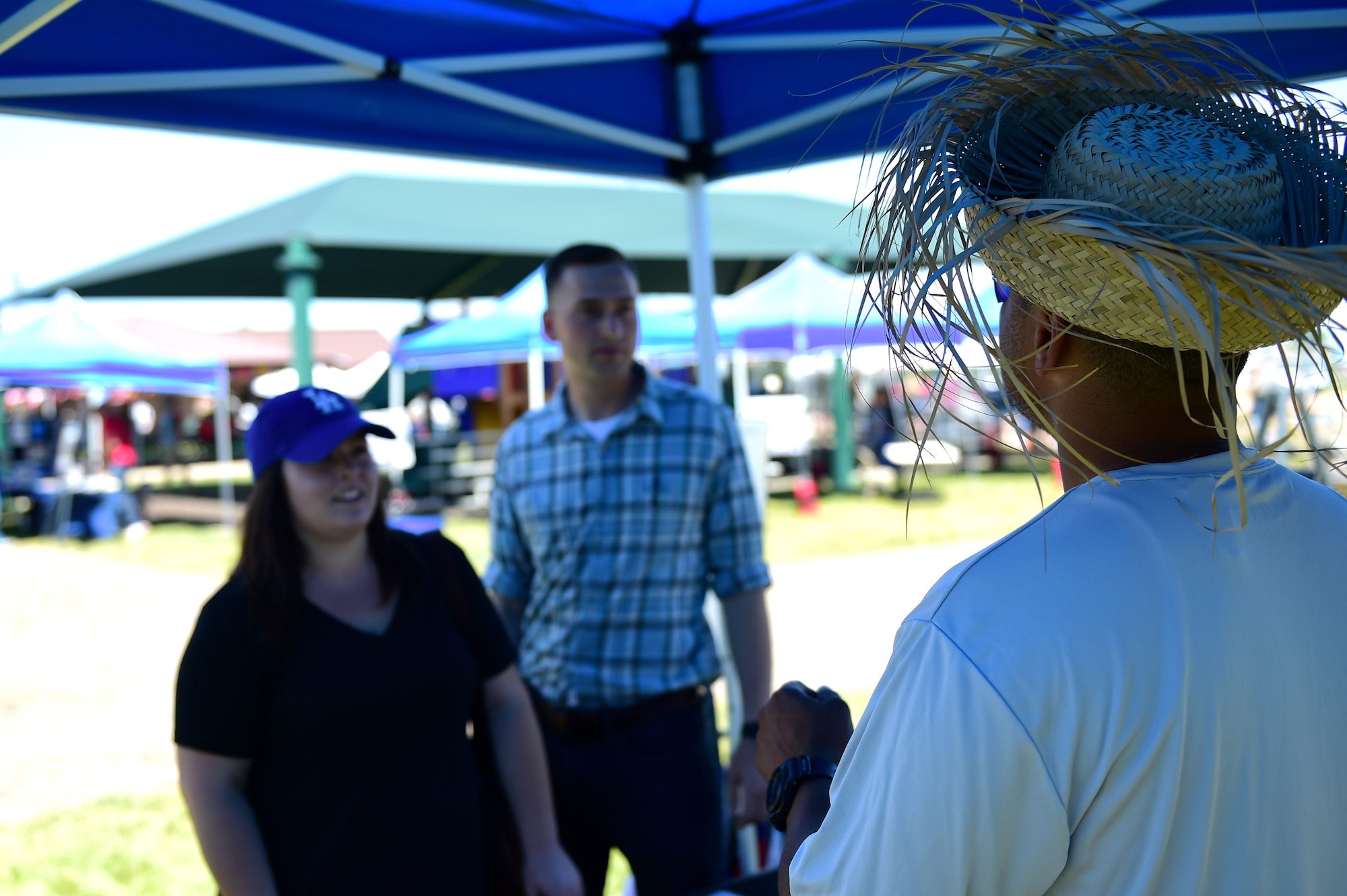 U.S. Air Force Tech. Sgt. Elias Ayala, Detachment 45 combat service support noncommissioned officer in charge, discusses Hispanic culture July 15, 2016, during Diversity Day on Buckley Air Force Base, Colo. Diversity Day provided an opportunity to explore and celebrate the accomplishments and cultures of a diverse military force, which included food, dancing and music from various cultures. (U.S. Air Force photo by Airman 1st Class Gabrielle Spradling/Released)