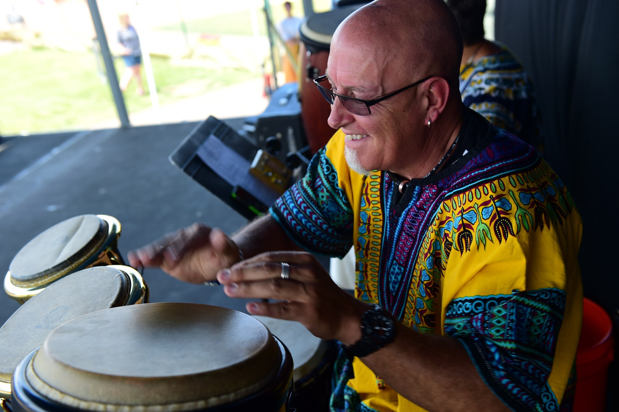 A drummer from the World Dance Show performs July 15, 2016, during Diversity Day on Buckley Air Force Base, Colo. Diversity Day provided an opportunity to explore and celebrate the accomplishments and cultures of a diverse military force, which included food, dancing and music from various cultures. (U.S. Air Force photo by Airman 1st Class Gabrielle Spradling/Released)