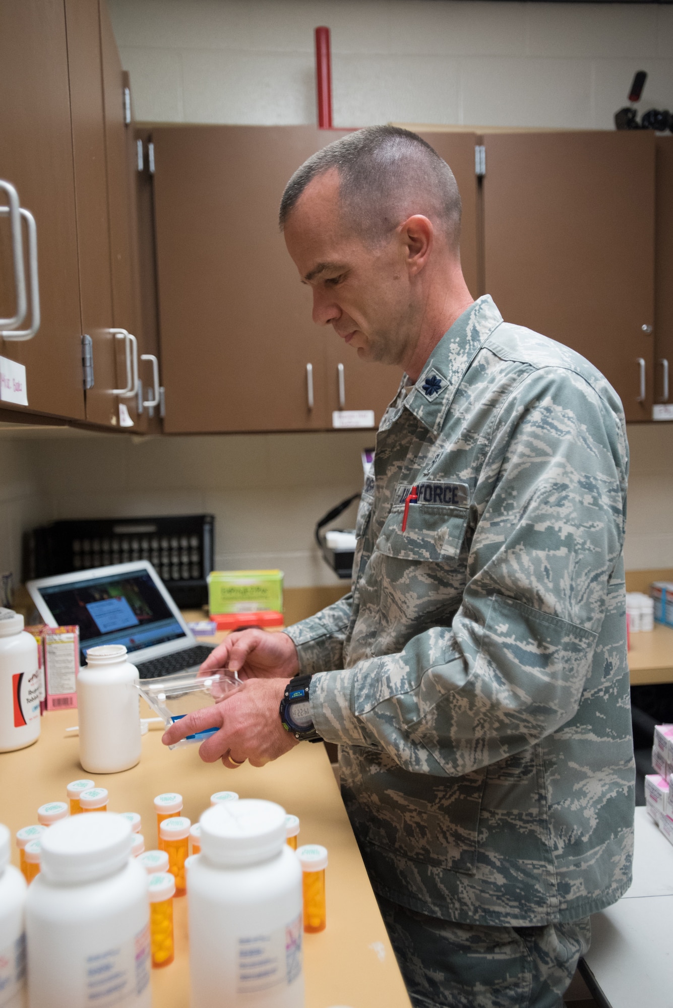 Lt. Col. Michael Cartwright, a pharmacist for Detachment 1 187th Medical Group, Alabama Air National Guard, counts medications at at Carlisle County High School in Bardwell, Ky., July 17, 2016, in preparation for Bluegrass Medical Innovative Readiness Training. The program will offer medical and dental care at no cost to residents in three Western Kentucky locations from July 18 to 27.(U.S. Air National Guard photo by Master Sgt. Phil Speck)