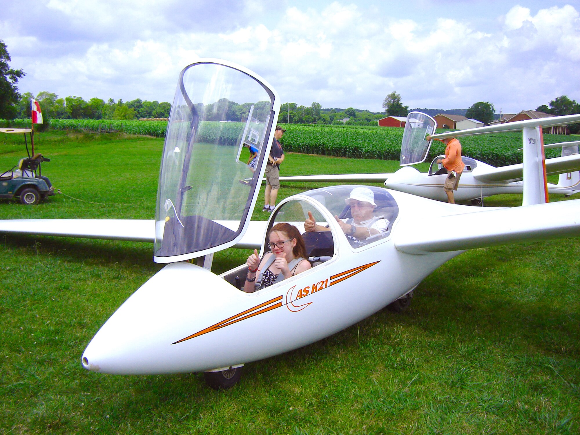 Mackenzie Holder (seated in front), a Coffee County Middle School student participating in the AEDC STEM Aviation Program, gives the “thumbs up” before beginning her glider flight for the program graduation July 8, 2016, in Eagleville, Tenn. Holder is accompanied by a volunteer with the Eagleville Soaring Club. The Aviation Program uses the Fly to Learn software, a 10-lesson curriculum using virtual airplanes to teach middle school students science concepts such as energy and forces. (Courtesy photo)