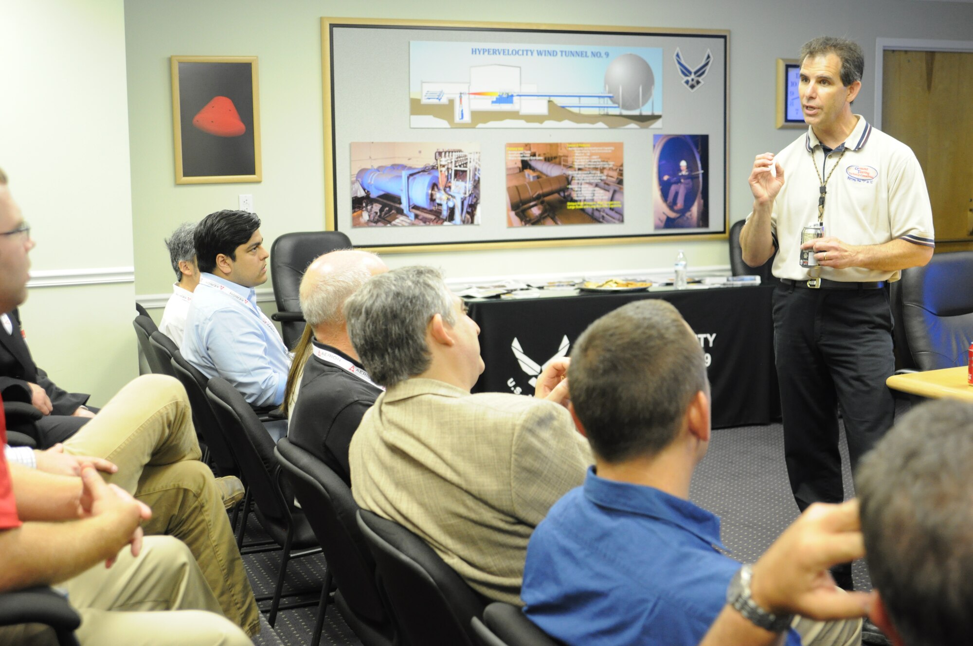 AEDC White Oak Site Director Dan Marren talks about Hypervelocity Wind Tunnel 9 and AEDC with stakeholders from the American Institute of Aeronautics and Astronautics Ground Test Technical Committee during a site visit. GTTC guests, in town for the Aviation 2016 Forum in Washington, D.C., were invited to tour AEDC White Oak in Silver Spring, Md. (U.S. Air Force photo/Robert W. Mitchell)