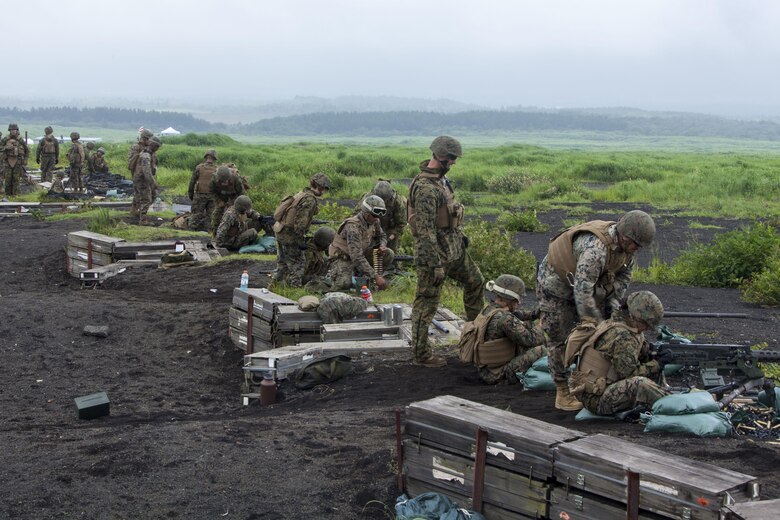 U.S. Marines with Marine Wing Support Squadron (MWSS) 171 stationed at Marine Corps Air Station Iwakuni, Japan, shoot on a machine-gun range during exercise Eagle Wrath 2016 at Combined Arms Training Center Camp Fuji, July 16, 2016. The annual exercise focuses on providing aviation-ground support to an assigned aviation combat element while reinforcing skills that Marines learned throughout their military occupational specialty schooling and Marine Combat Training. The squadron plans to complete their unit annual training requirements throughout three stages, which focus on air base ground defense and Marine Corps common skills that Marines are unable to train for locally. (U.S. Marine Corps photo by Lance Cpl. Aaron Henson)