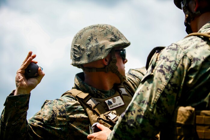 U.S. Marine Corps Sgt. Micah Steven McMackins, an aircraft rescue and firefighting specialist with Headquarters and Headquarters Squadron stationed at Marine Corps Air Station Iwakuni, Japan, prepares to throw an M69 practice grenade as part of a grenade training range during exercise Eagle Wrath 2016 at Combined Arms Training Center Camp Fuji, July 11, 2016. The annual exercise focus on providing aviation-ground support to an assigned aviation combat element while reinforcing skills that Marines learned throughout their military occupational specialty schooling and Marine Combat Training. (U.S. Marine Corps photo by Lance Cpl. Aaron Henson/Released)