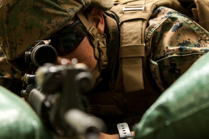 U.S. Marine Corps Pfc. Simon Gomezramirez, a combat engineer with Marine Wing Support Squadron (MWSS) 171, provides security after constructing a defensive position during exercise Eagle Wrath 2016 at Combined Arms Training Center Camp Fuji on July 14, 2016. The squadron plans to complete their unit annual training requirements throughout three stages, which focus on air base ground defense and Marine Corps common skills that Marines are unable to train for locally. (U.S. Marine Corps photo by Lance Cpl. Aaron Henson/Released)