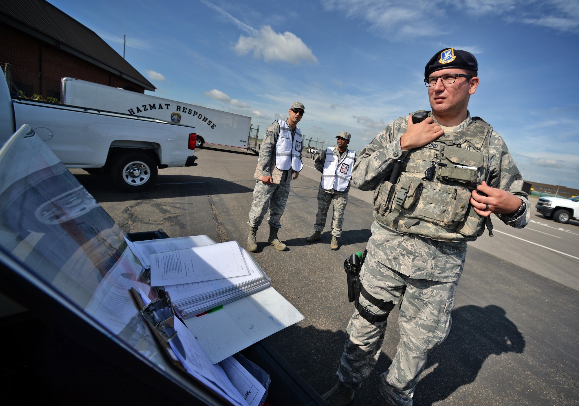 U.S. Air Force Tech. Sgt. Robert Woodford, 100th Security Forces Squadron flight chief, coordinates SFS response during an exercise July 16, 2016, on RAF Mildenhall, England. The exercise tested Team Mildenhall first responders during a simulated fuel spill. (U.S. Air Force photo by Senior Airman Christine Halan) 