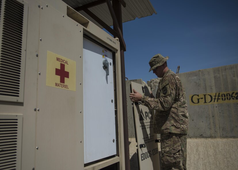 Staff Sgt. Alexander Stansbury, 455th Expeditionary Medical Group, biomedical equipment technician, checks an Expeditionary Deployable Oxygen Concentration System (EDOCS), Bagram Airfield, Afghanistan, July 18, 2016. The EDOCS take the outside air, filters out the nitrogen and carbon dioxide and delivers 93 percent of medical oxygen to the hospital during treatment.(U.S. Air Force photo by Senior Airman Justyn M. Freeman)