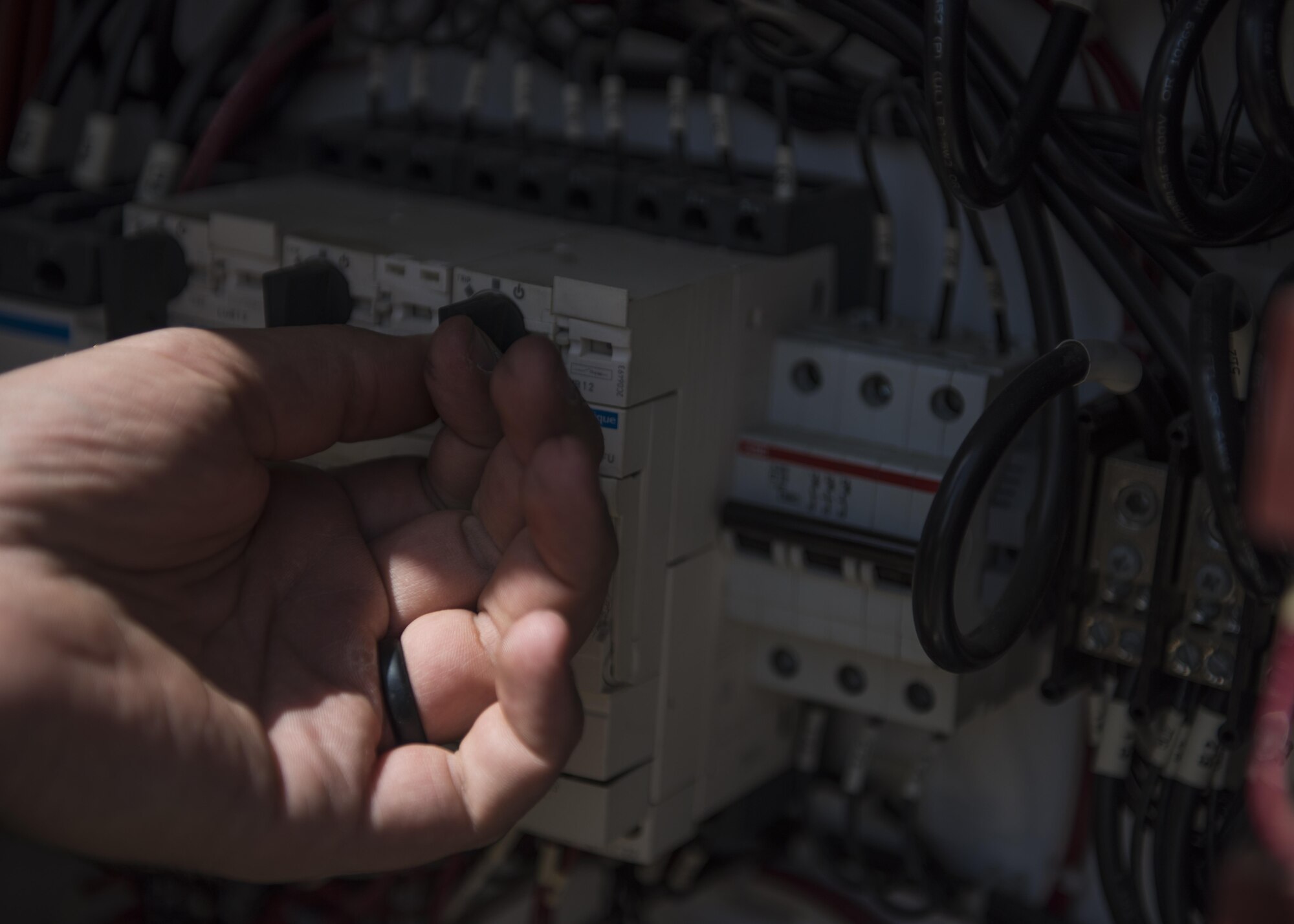 Staff Sgt. Alexander Stansbury, 455th Expeditionary Medical Group, bioenvironmental equipment technician, resets a circuit breaker, Bagram Airfield, Afghanistan, July 18, 2016. Breakers must be reset when the blower switch assembly doesn’t start up correctly. The blower is an essential part of the Expeditionary Deployable Oxygen Concentration System, allowing the system to generate oxygen provided to patients at the Join-Craig Theater Hospital. (U.S. Air Force photo by Senior Airman Justyn M. Freeman)