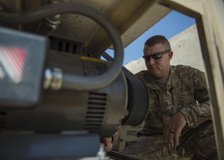 Staff Sgt. Alexander Stansbury, 455th Expeditionary Medical Group, bioenvironmental equipment technician, fixes the alignment on a blower motor, Bagram Airfield, Afghanistan, July 18, 2016.The alignment on a blower motor belt drive system must be correct to prevent the motor belt from snapping off, causing the Expeditionary Deployable Oxygen Concentration System unusable. Alignment checks are completed on a monthly basis, to make sure the blower motor is working properly. (U.S. Air Force photo by Senior Airman Justyn M. Freeman)