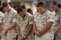 NAVAL SUPPORT FACILITY INDIAN HEAD, MD -- Marines and sailors with Headquarters and Service Company, Chemical Biological Incident Response Force, CBIRF, bow their head for an invocation given during a change of command ceremony at Naval Support Facility Indian Head, Md., July 13, 2016. Capt. Robert G. Ukrainec assumed command from Capt. Lucas H. Forcella, and the two gave remarks during the ceremony thanking their leadership and families. (Official USMC Photo by Sgt. Jonathan S. Herrera/Released)
