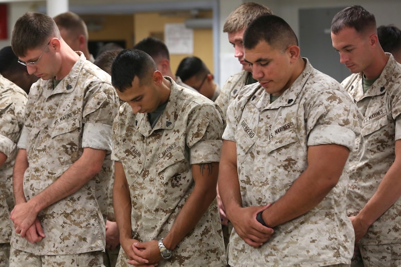 NAVAL SUPPORT FACILITY INDIAN HEAD, MD -- Marines and sailors with Headquarters and Service Company, Chemical Biological Incident Response Force, CBIRF, bow their head for an invocation given during a change of command ceremony at Naval Support Facility Indian Head, Md., July 13, 2016. Capt. Robert G. Ukrainec assumed command from Capt. Lucas H. Forcella, and the two gave remarks during the ceremony thanking their leadership and families. (Official USMC Photo by Sgt. Jonathan S. Herrera/Released)
