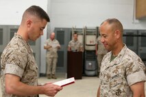 NAVAL SUPPORT FACILITY INDIAN HEAD, MD -- Col. Michael L. Carter (right), commanding officer of Chemical Biological Incident Response Force, presents Capt. Lucas H. Forcella with a Navy and Marine Corps Commendation Medal following a change of command ceremony at Naval Support Facility Indian Head, Md., July 13, 2016. Forcella served as the company commander for Headquarters and Service Company and relinquished command to Capt. Robert G. Ukrainec. (Official USMC Photo by Sgt. Jonathan S. Herrera/Released)
