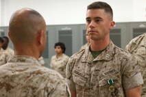 NAVAL SUPPORT FACILITY INDIAN HEAD, MD -- Col. Michael L. Carter, commanding officer of Chemical Biological Incident Response Force, presents Capt. Lucas H. Forcella with a Navy and Marine Corps Commendation Medal following a change of command ceremony at Naval Support Facility Indian Head, Md., July 13, 2016. Forcella served as the company commander for Headquarters and Service Company and relinquished command to Capt. Robert G. Ukrainec. (Official USMC Photo by Sgt. Jonathan S. Herrera/Released)
