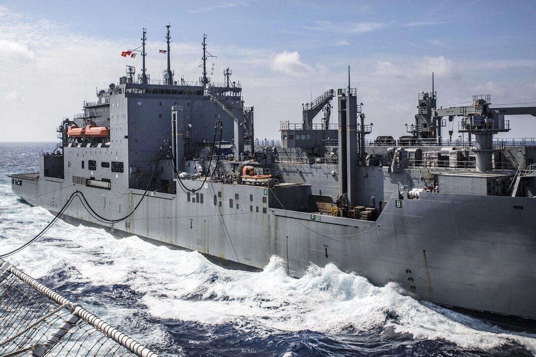 The USNS Wally Schirra connects a fuel line to hospital ship USNS Mercy during a replenishment at sea in the South China Sea, July 13, 2016. Marine Corps photo by Sgt. Brittney Vella