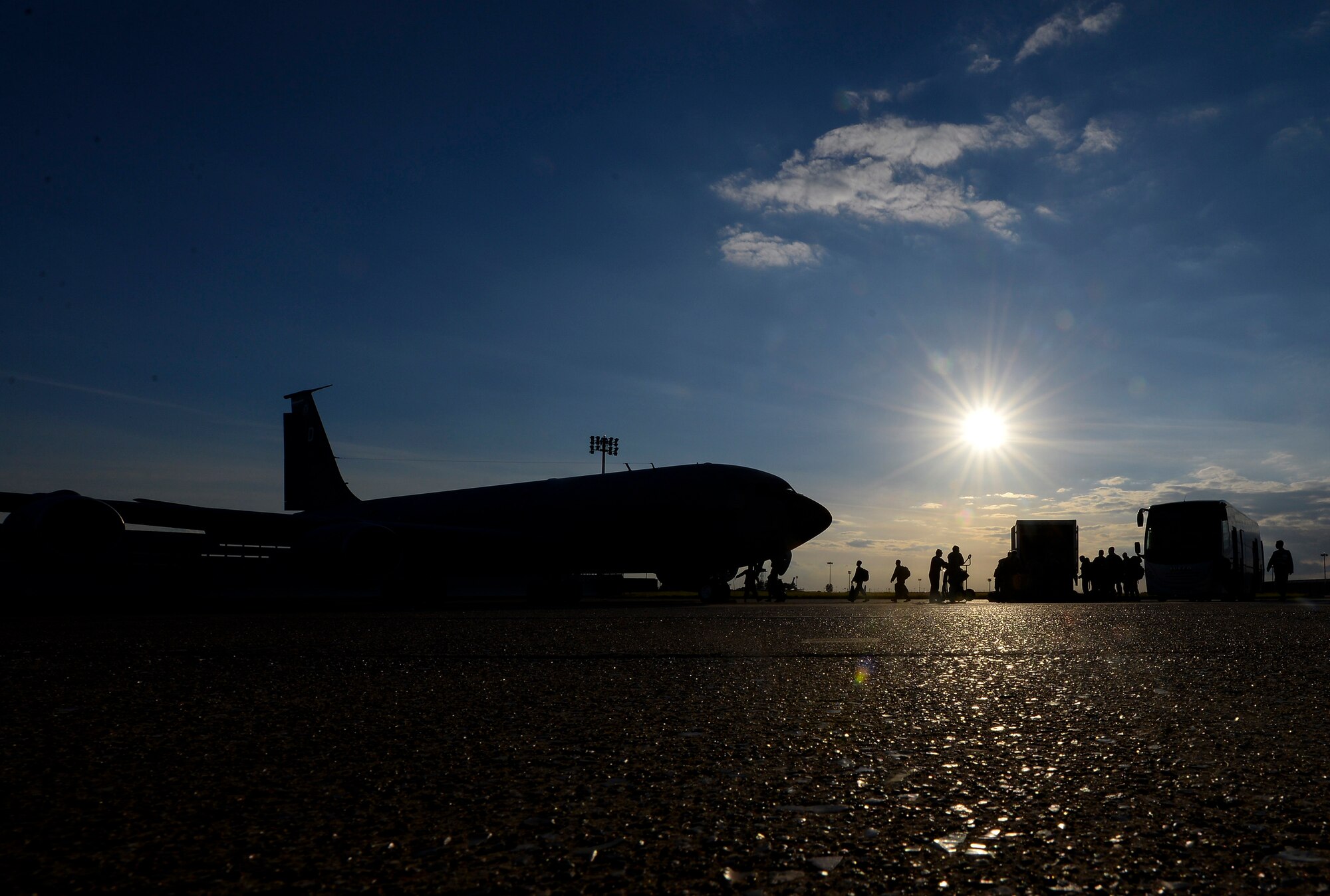 U.S. Air Force Airmen prepare to board a KC-135 Stratotanker during an exercise July 14, 2016, on RAF Mildenhall, England. Airmen from various units were selected for the exercise to test and hone the base’s ability to equip, out-process, brief, load and deploy personnel.  (U.S. Air Force photo by Staff Sgt. Micaiah Anthony)