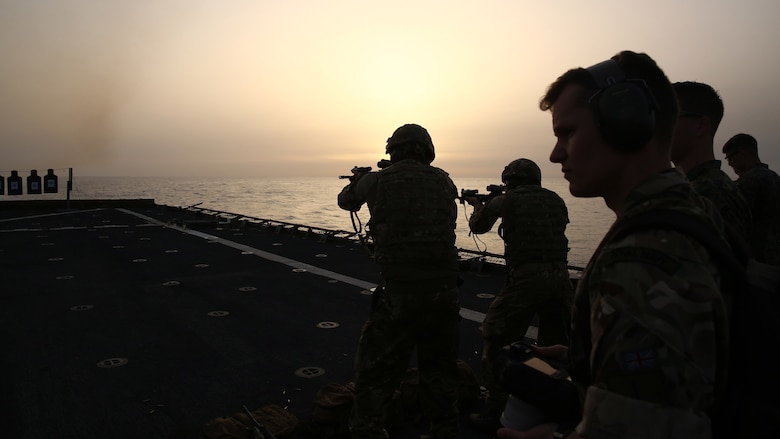 United Kingdom British Royal Marines fire M4 carbines during a demonstration with 22nd Marine Expeditionary Unit aboard the amphibious dock landing ship USS Whidbey Island, July 8, 2016. 22nd MEU, deployed with the Wasp Amphibious Ready Group, is conducting naval operations in the U.S. 6th Fleet area of operations in support of U.S. national security interests in Europe. 